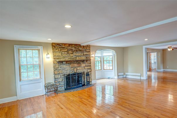 Empty room, Fireplace, Interior, Recessed Lighting, Stone Walls, Wood Texture Flooring