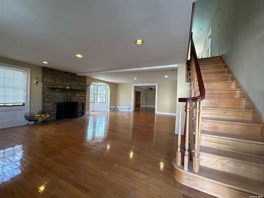 Empty room, Fireplace, Interior, Recessed Lighting, Stone Walls, Wood Texture Flooring