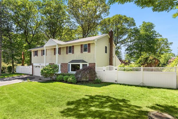 Attached, Backyard, Exterior, Facade, Brick Facade, Raised Ranch
