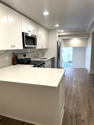 Interior, Kitchen, Recessed Lighting, Stainless Steel Appliances, Wood Texture Flooring