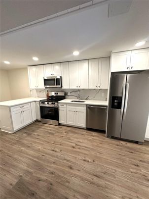 Interior, Kitchen, Recessed Lighting, Stainless Steel Appliances, Wood Texture Flooring