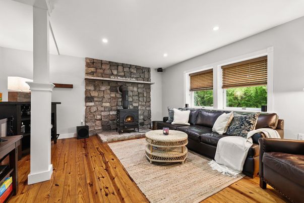 Fireplace, Interior, Living room, Recessed Lighting, Stone Walls, Wood Texture Flooring