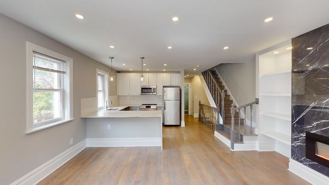 Fireplace, Interior, Kitchen, Marble Walls, Pendant Lights, Recessed Lighting, Stainless Steel Appliances, Wood Texture Flooring