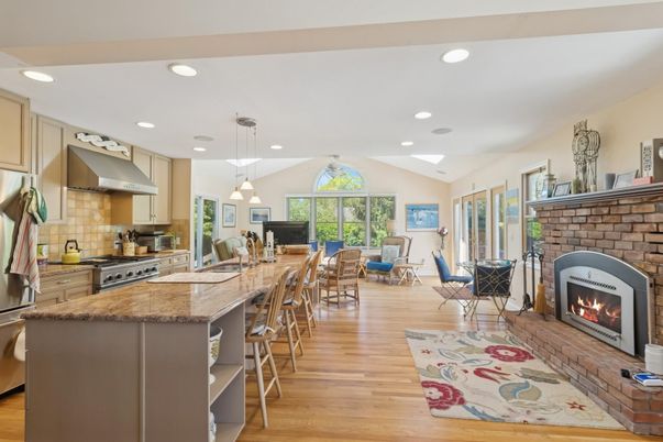 Dining room, Fireplace, Interior, Kitchen, Pendant Lights, Recessed Lighting, Stainless Steel Appliances, Wood Texture Flooring