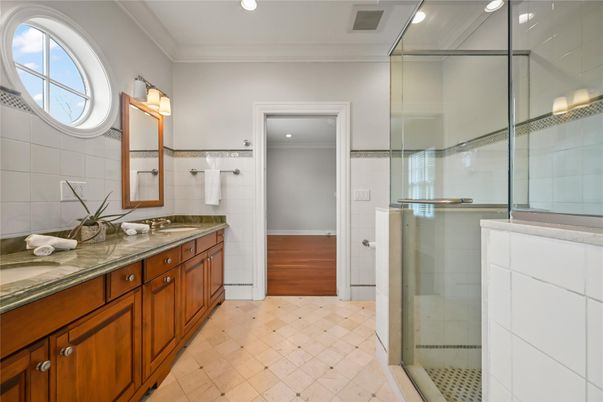 Bathroom, Dual Sink Vanities, Glass Shower, Interior, Recessed Lighting, Wood Texture Flooring