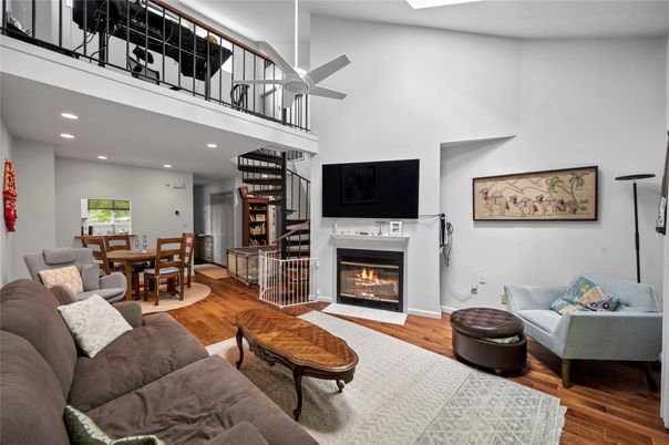 Dining room, Fireplace, Interior, Living room, Recessed Lighting, Wood Texture Flooring