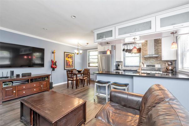 Dining room, Interior, Kitchen, Pendant Lights, Recessed Lighting, Stainless Steel Appliances, Wood Texture Flooring