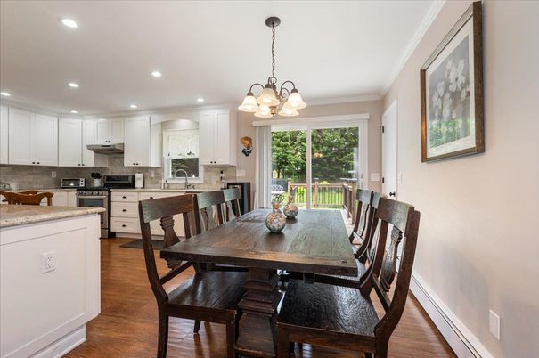 Chandelier, Dining room, Interior, Kitchen, Recessed Lighting, Stainless Steel Appliances, Wood Texture Flooring