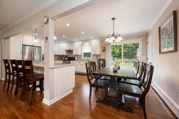 Chandelier, Dining room, Interior, Kitchen, Pendant Lights, Recessed Lighting, Stainless Steel Appliances, Wood Texture Flooring