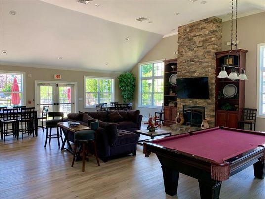 Billiard Table, Dining room, Fireplace, Game Room, Interior, Living room, Pendant Lights, Recessed Lighting, Stone Walls, Wood Texture Flooring