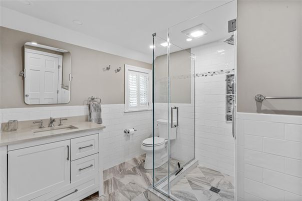 Bathroom, Dual Sink Vanities, Glass Shower, Interior, Marble, Recessed Lighting