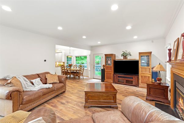 Dining room, Fireplace, Interior, Living room, Pendant Lights, Recessed Lighting, Wood Texture Flooring