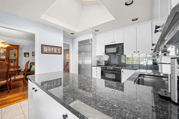 Dining room, Interior, Kitchen, Recessed Lighting, Stainless Steel Appliances, Wood Texture Flooring