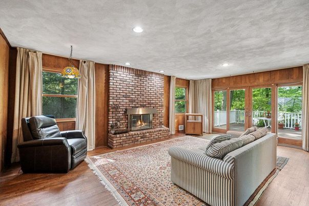 Fireplace, Interior, Living room, Pendant Lights, Recessed Lighting, Stone Walls, Wood Texture Flooring