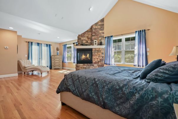 Bedroom, Fireplace, Interior, Recessed Lighting, Stone Walls, Wood Texture Flooring