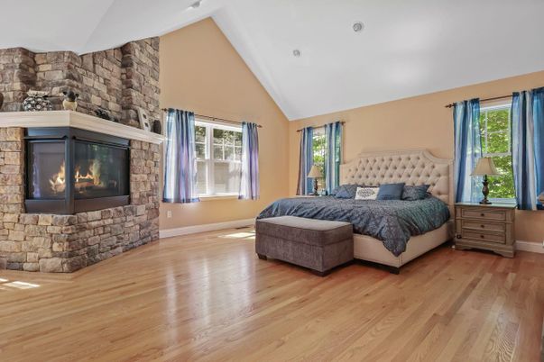 Bedroom, Fireplace, Interior, Recessed Lighting, Stone Walls, Wood Texture Flooring