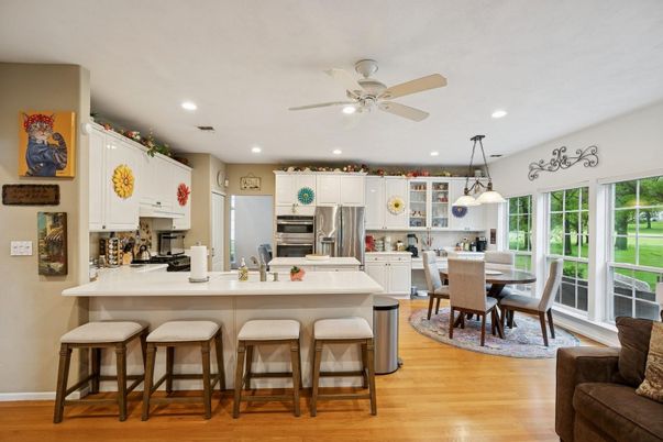 Dining room, Interior, Kitchen, Pendant Lights, Recessed Lighting, Stainless Steel Appliances, Wood Texture Flooring