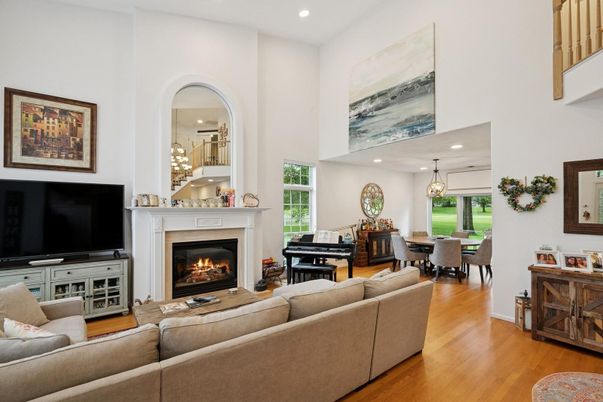 Chandelier, Dining room, Fireplace, Interior, Living room, Pendant Lights, Piano, Recessed Lighting, Wood Texture Flooring