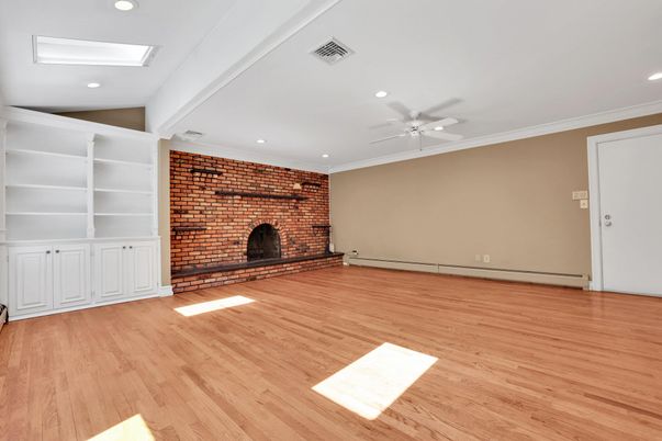 Empty room, Fireplace, Interior, Recessed Lighting, Stone Walls, Wood Texture Flooring