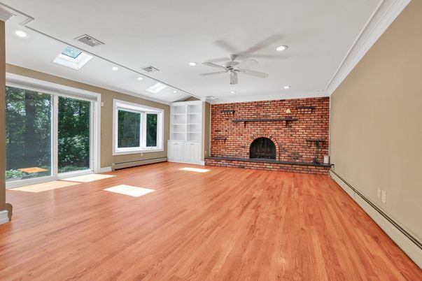 Empty room, Fireplace, Interior, Recessed Lighting, Stone Walls, Wood Texture Flooring