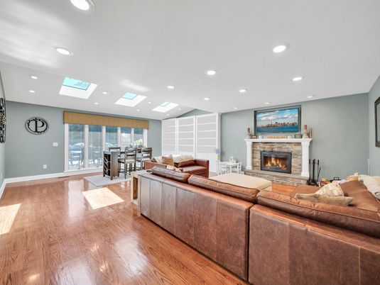 Dining room, Fireplace, Interior, Living room, Recessed Lighting, Wood Texture Flooring