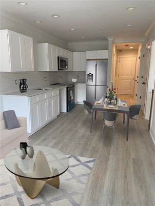 Dining room, Interior, Kitchen, Recessed Lighting, Stainless Steel Appliances, Wood Texture Flooring