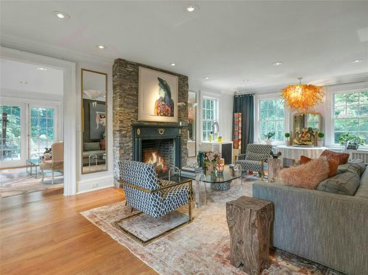 Chandelier, Fireplace, Interior, Living room, Recessed Lighting, Stone Walls, Wood Texture Flooring