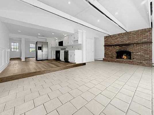 Empty room, Fireplace, Interior, Kitchen, Recessed Lighting, Stone Walls, Wood Texture Flooring