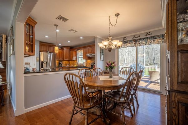 Chandelier, Dining room, Interior, Kitchen, Pendant Lights, Recessed Lighting, Stainless Steel Appliances, Wood Texture Flooring