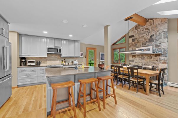 Dining room, Interior, Kitchen, Pendant Lights, Recessed Lighting, Stainless Steel Appliances, Stone Walls, Wood Texture Flooring