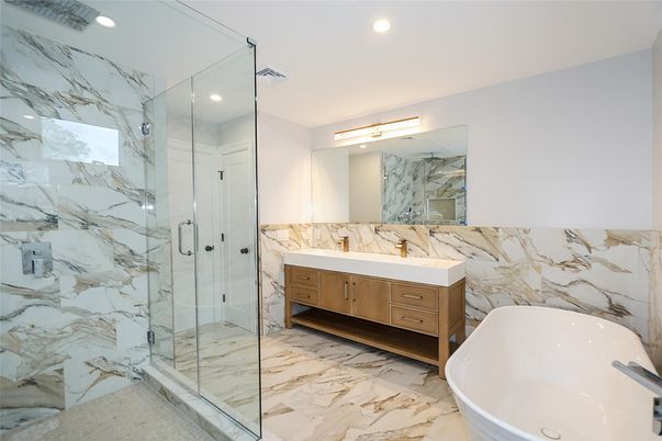 Bathroom, Dual Sink Vanities, Free Standing Baths, Glass Shower, Interior, Marble, Marble Walls, Recessed Lighting