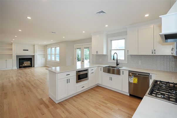 Fireplace, Interior, Kitchen, Recessed Lighting, Stainless Steel Appliances, Wood Texture Flooring