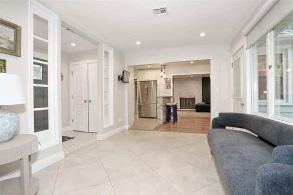 Fireplace, Interior, Kitchen, Living room, Pendant Lights, Recessed Lighting, Stainless Steel Appliances, Stone Walls, Wood Texture Flooring