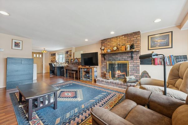 Fireplace, Interior, Living room, Piano, Recessed Lighting, Stone Walls, Wood Texture Flooring