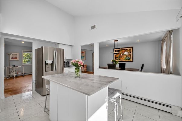 Dining room, Interior, Kitchen, Pendant Lights, Recessed Lighting, Stainless Steel Appliances, Wood Texture Flooring
