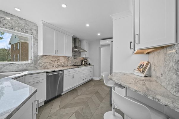 Interior, Kitchen, Marble Walls, Recessed Lighting, Stainless Steel Appliances