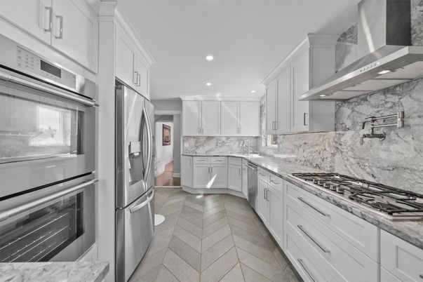 Interior, Kitchen, Marble Walls, Recessed Lighting, Stainless Steel Appliances