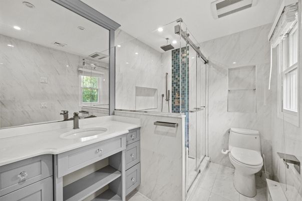 Bathroom, Dual Sink Vanities, Glass Shower, Interior, Marble, Marble Walls, Recessed Lighting