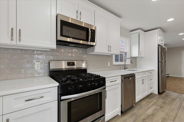 Interior, Kitchen, Recessed Lighting, Stainless Steel Appliances, Wood Texture Flooring