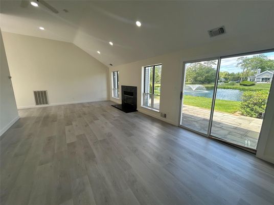 Empty room, Fireplace, Interior, Recessed Lighting, Water, Wood Texture Flooring