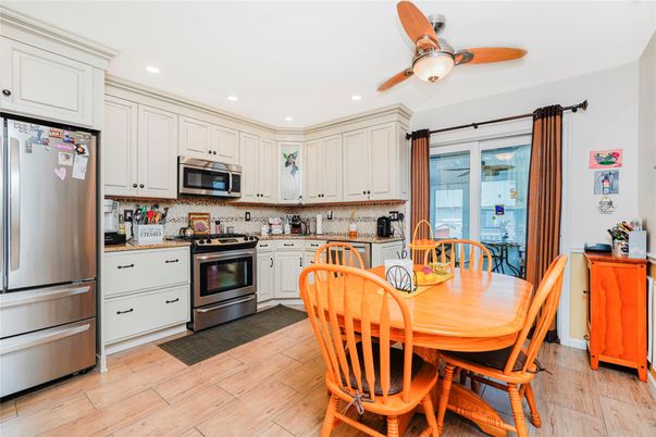 Dining room, Interior, Kitchen, Recessed Lighting, Stainless Steel Appliances, Wood Texture Flooring