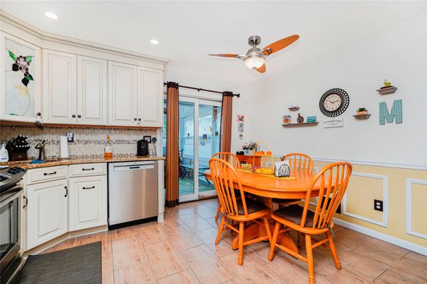 Dining room, Interior, Kitchen, Recessed Lighting, Stainless Steel Appliances, Wood Texture Flooring