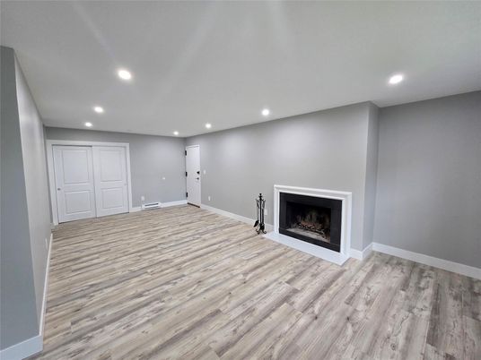Empty room, Fireplace, Interior, Recessed Lighting, Wood Texture Flooring