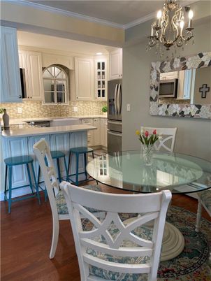 Chandelier, Dining room, Interior, Kitchen, Stainless Steel Appliances, Wood Texture Flooring