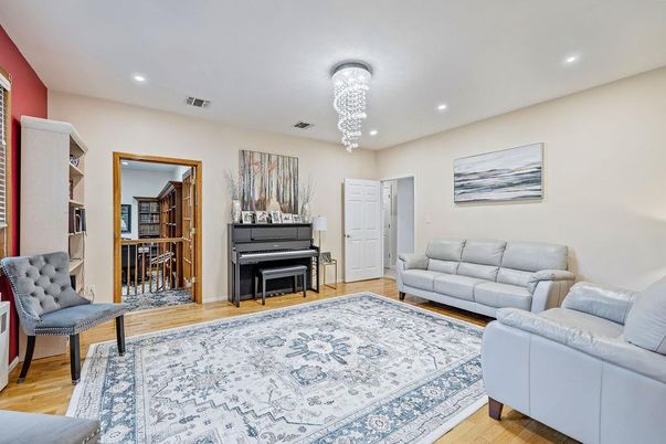 Chandelier, Interior, Living room, Piano, Recessed Lighting, Wood Texture Flooring