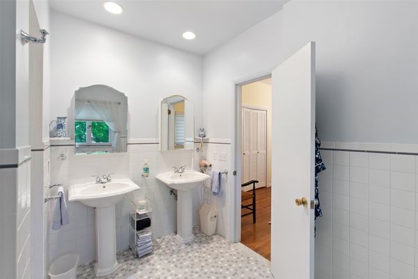 Bathroom, Dual Sink Vanities, Interior, Recessed Lighting, Wood Texture Flooring