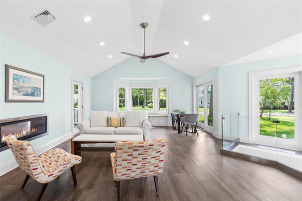 Dining room, Fireplace, Interior, Living room, Recessed Lighting, Wood Texture Flooring