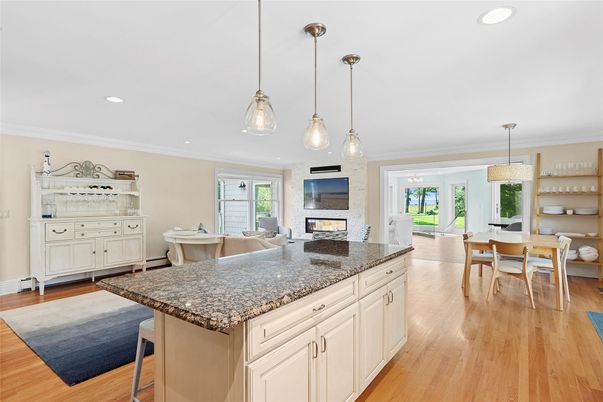 Dining room, Fireplace, Interior, Living room, Pendant Lights, Recessed Lighting, Wood Texture Flooring