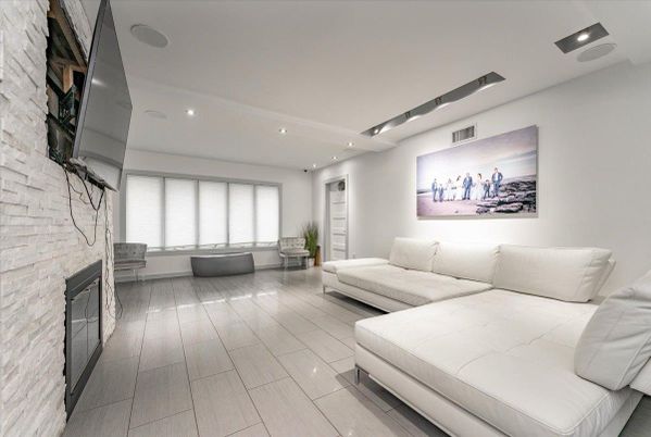 Fireplace, Interior, Living room, Recessed Lighting, Stone Walls, Wood Texture Flooring