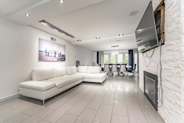 Dining room, Fireplace, Interior, Living room, Pendant Lights, Recessed Lighting, Stone Walls, Wood Texture Flooring